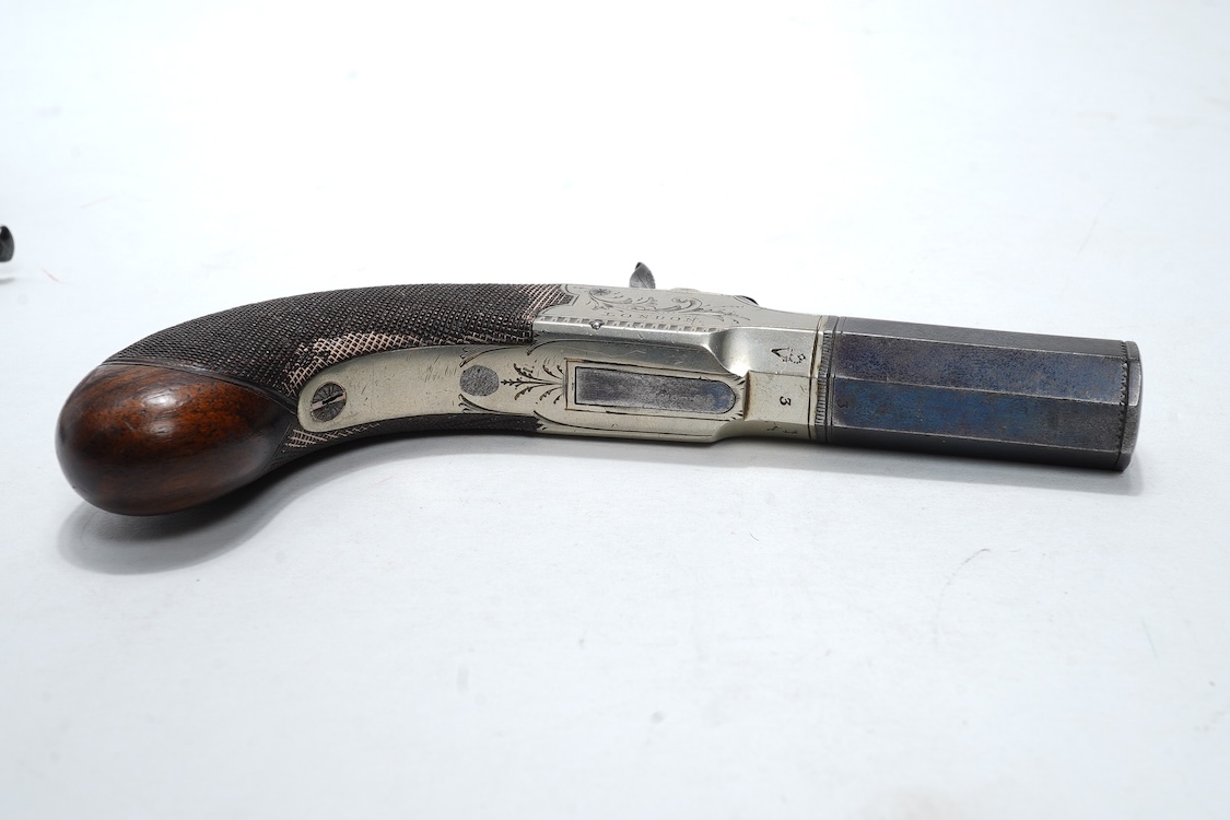 A pair of boxlock percussion pocket pistols with 4cm octagonal barrels, the frames engraved Lacy & Co., London, with London proof marks and rounded chequered walnut butts (2)